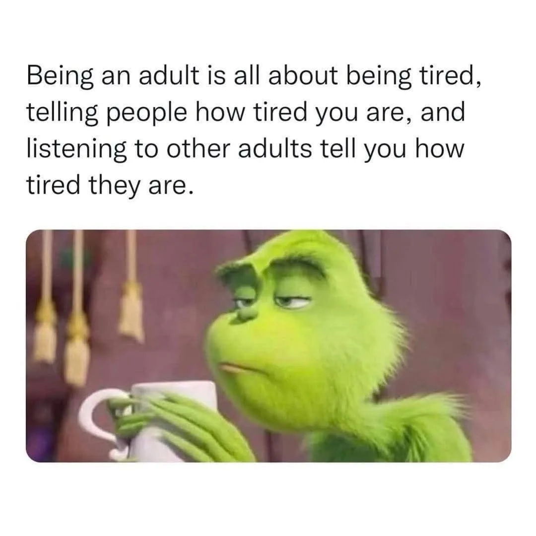 The image shows the green, furry Grinch from the movie 'How the Grinch Stole Christmas,' looking exhausted with half-closed…