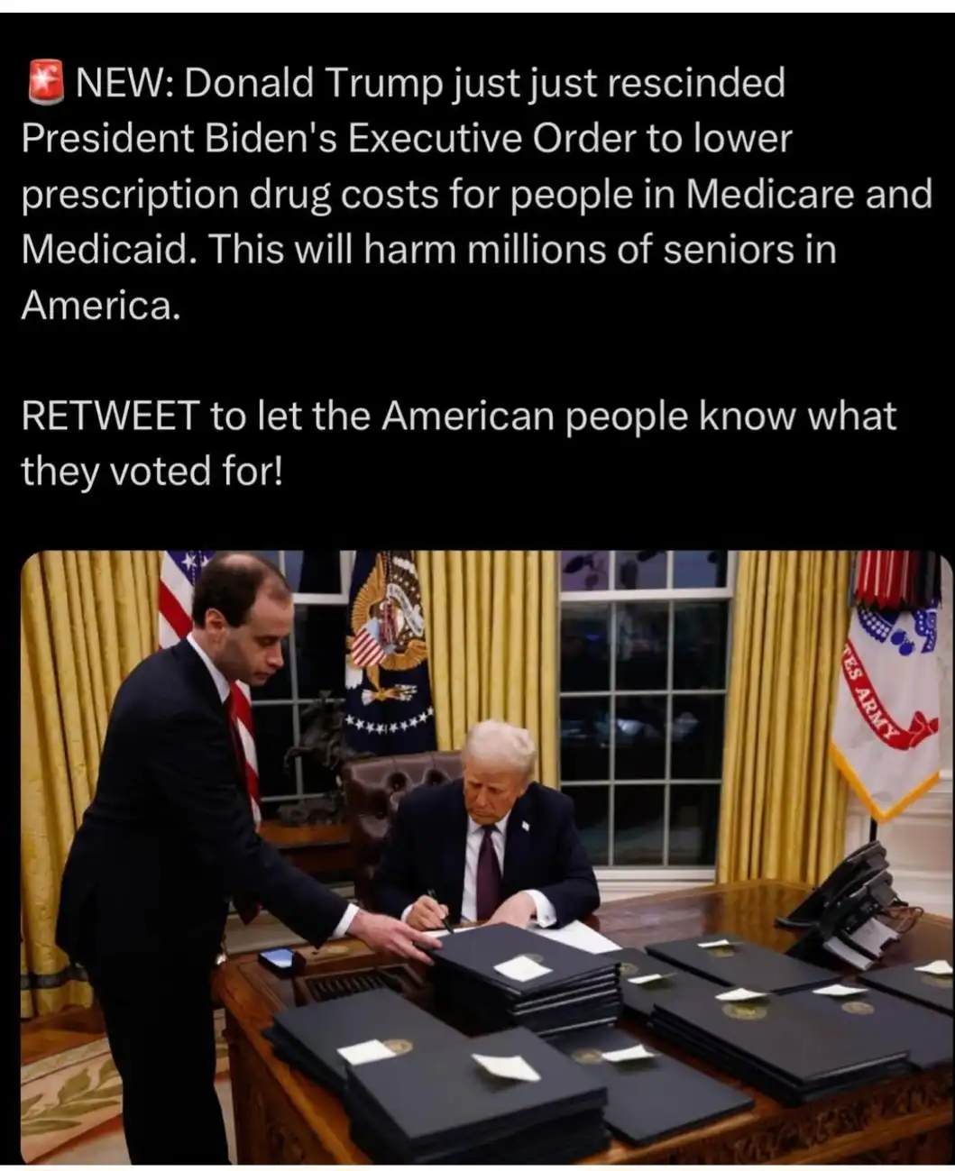 The image shows Donald Trump seated at a large wooden desk in the Oval Office, signing documents while a man in a suit…