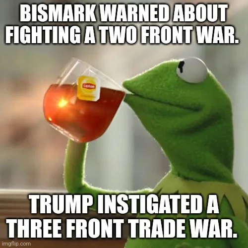 A green frog puppet, Kermit the Frog, is shown holding a glass of tea with a Lipton tea bag visible, sipping it calmly while…