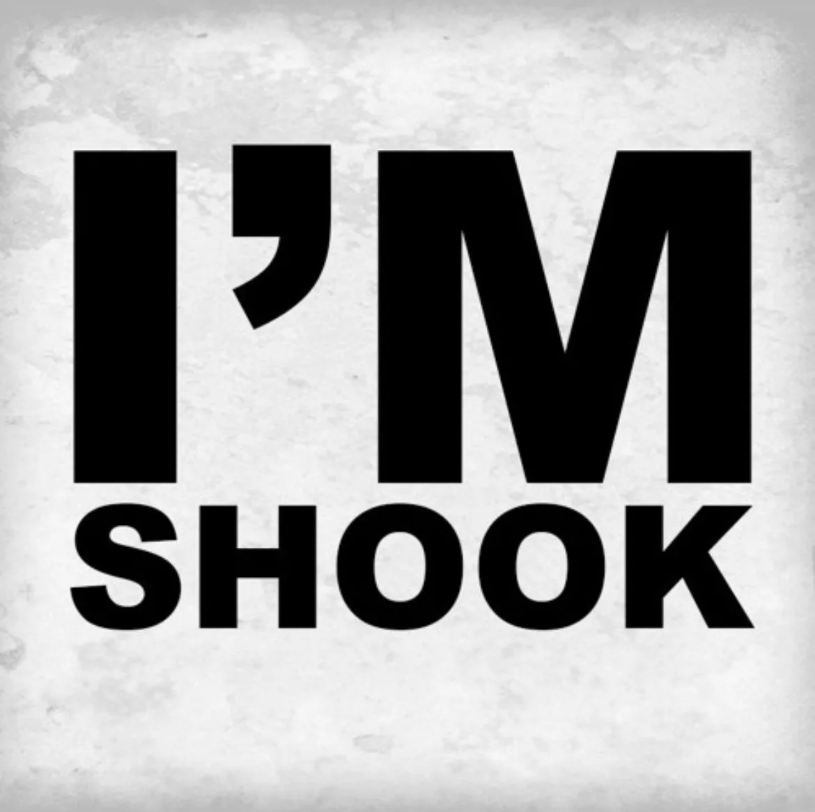 The image displays bold, black, sans-serif text reading 'I'M SHOOK' centered on a textured, light gray background resembling…