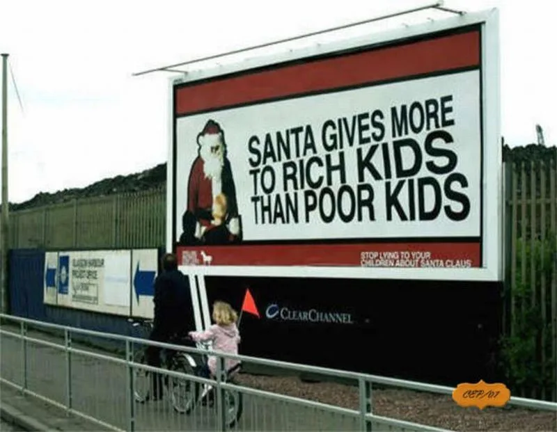 A large billboard features a cartoon Santa Claus holding a baby, with bold text declaring 'SANTA GIVES MORE TO RICH KIDS…