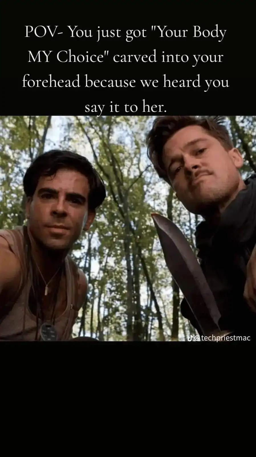 The image shows two men in a forest, one holding a large knife and looking menacingly at the camera, while the other looks…