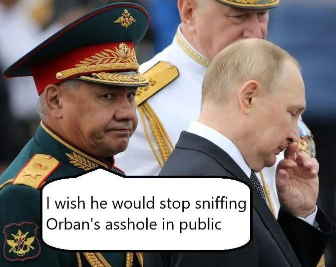 A photo shows Russian President Vladimir Putin in a suit, sniffing his fingers while looking down, with a stern-looking…