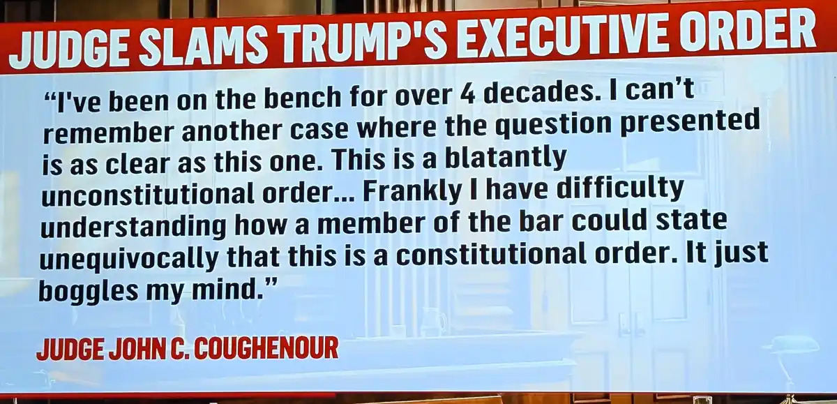 A news graphic overlaying a courtroom background with bold red header text reading 'JUDGE SLAMS TRUMP'S EXECUTIVE ORDER'…