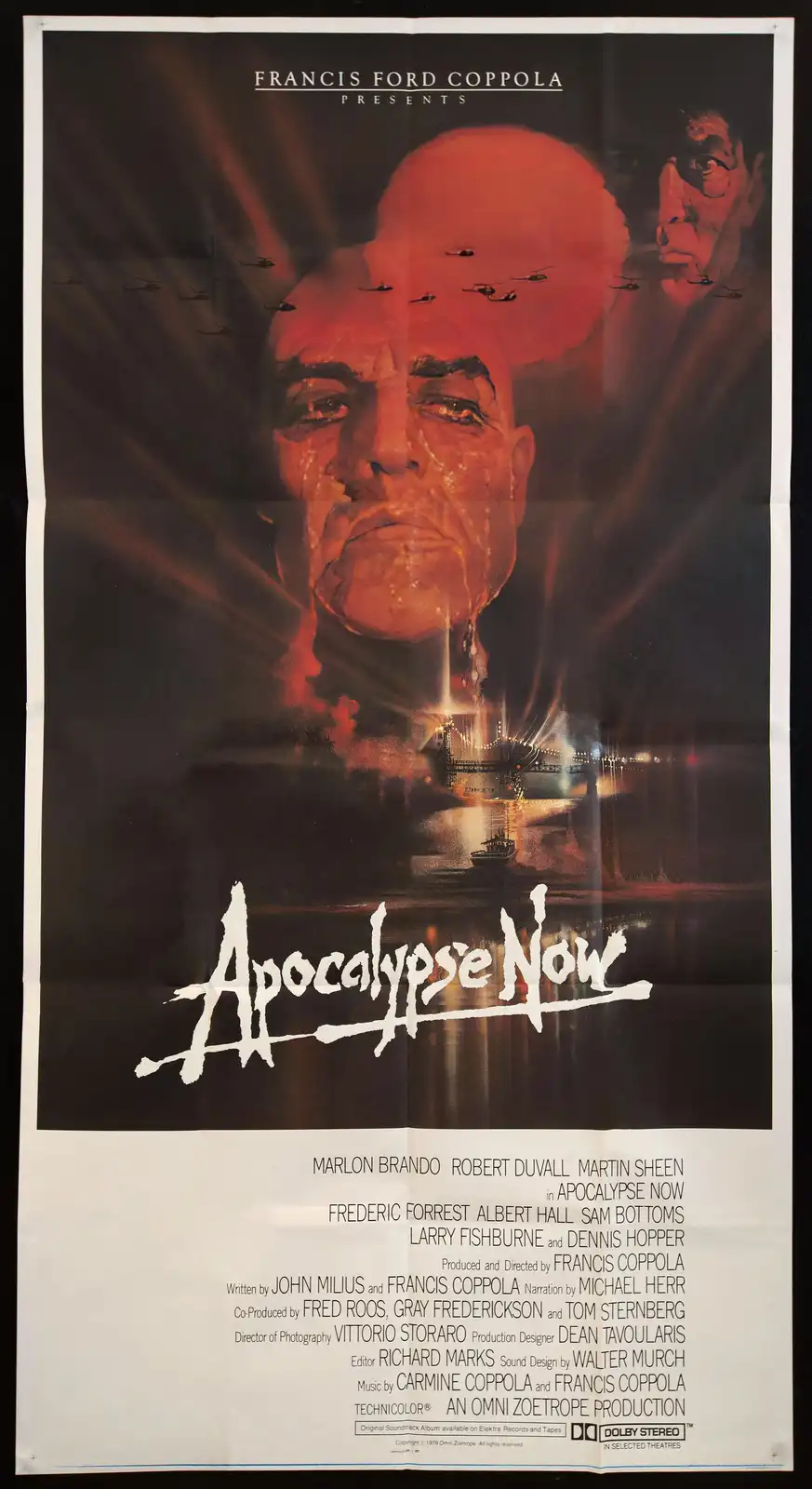 This is the original movie poster for 'Apocalypse Now,' featuring a large, intense close-up of Marlon Brando's face with…