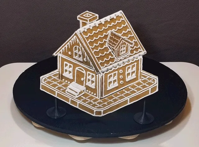 A sequence of six images shows a gingerbread house being progressively dismantled into scattered pieces on a black…