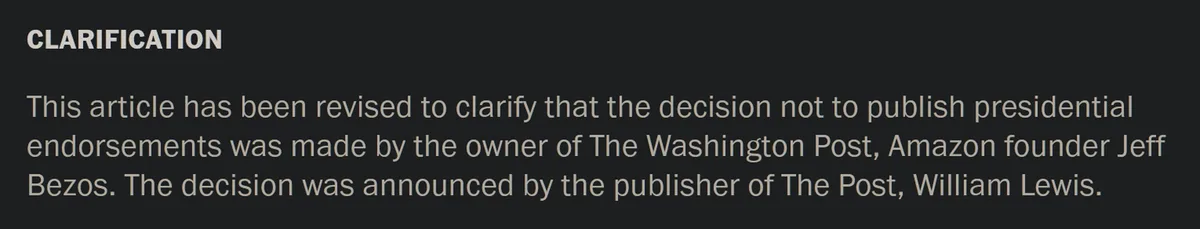 A dark gray background displays white text titled 'CLARIFICATION' followed by a paragraph stating an article was revised to…