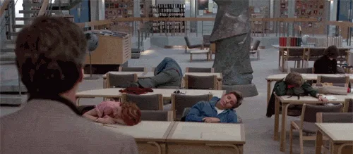 A sequence of frames from a movie showing students in a classroom, initially slumped over desks, then gradually raising…