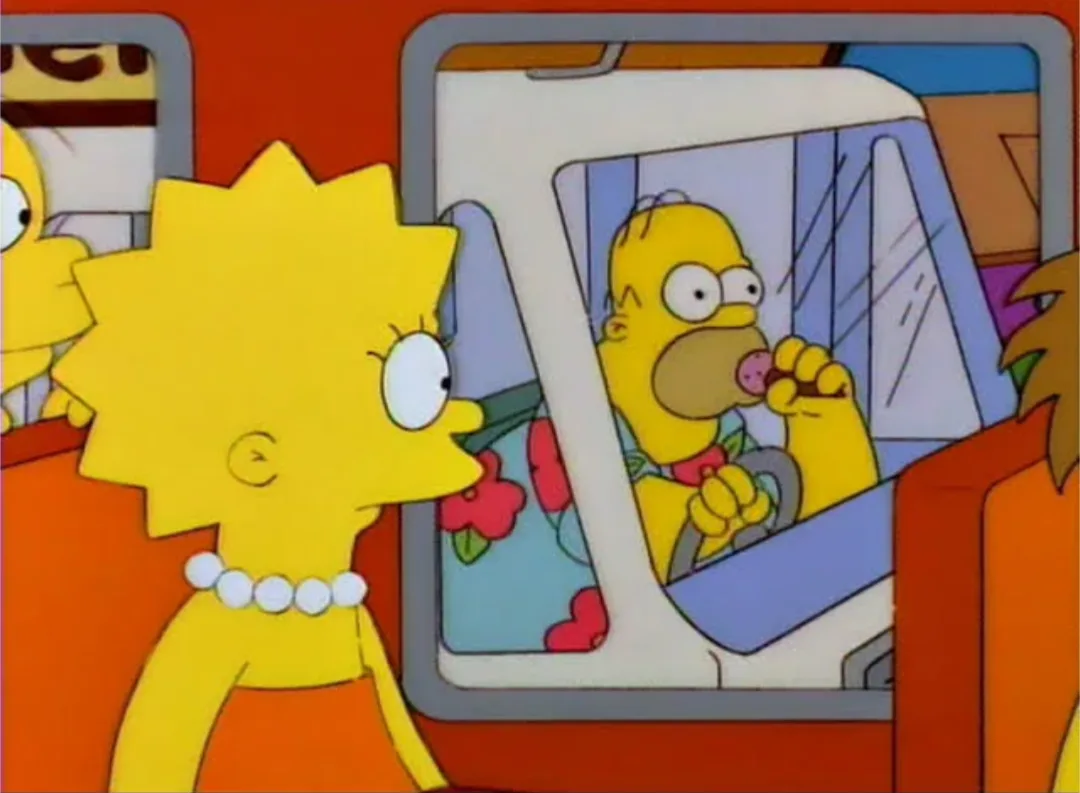 In this still from The Simpsons, Lisa Simpson, wearing a pearl necklace and orange dress, looks toward Homer Simpson who is…