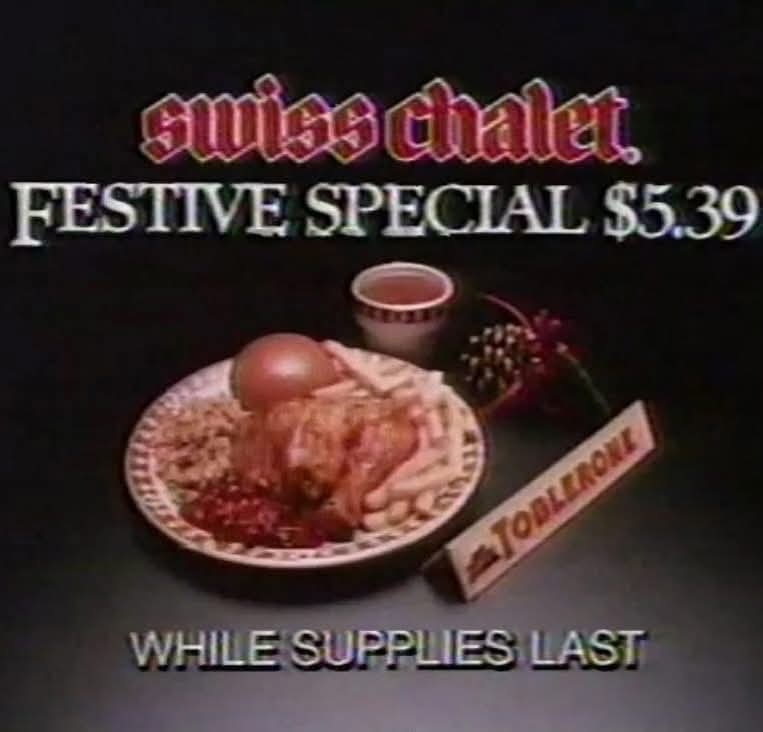 A vintage Swiss Chalet restaurant advertisement shows a plate with fried chicken, mashed potatoes, cranberry sauce, and a…