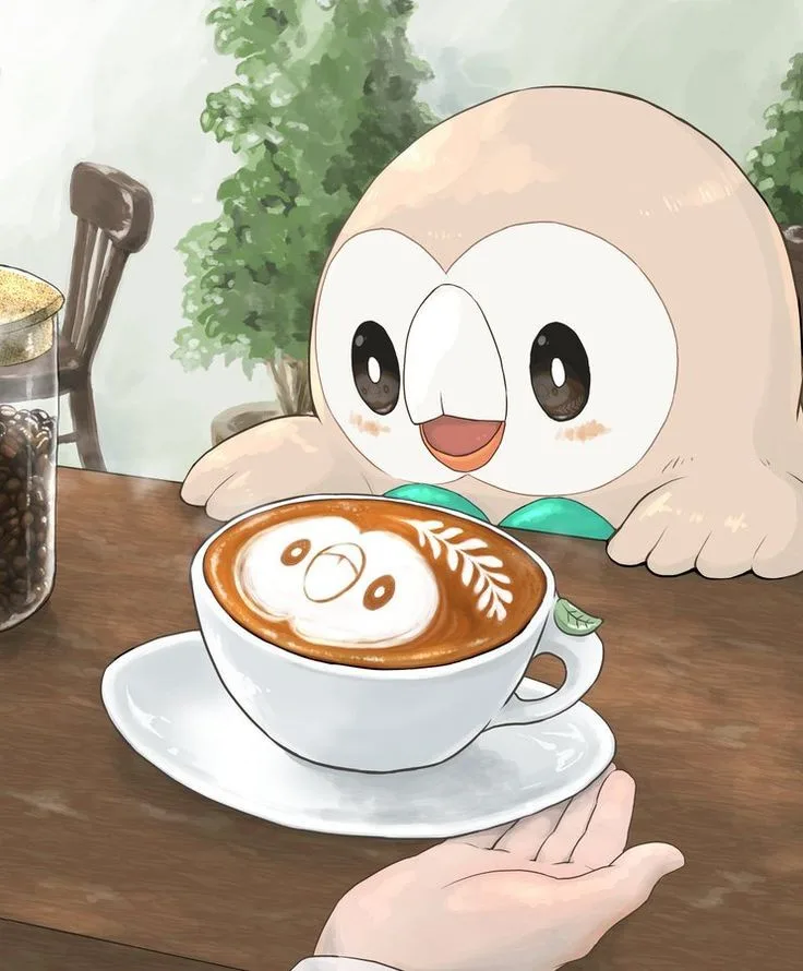 A cartoon owl-like Pokémon, Rowlet, is shown leaning over a table with a delighted expression, looking at a cup of coffee…