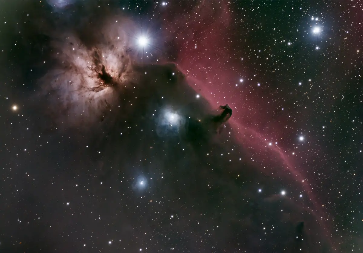 A stunning astrophotograph of the Orion Nebula, featuring glowing pink and blue gas clouds, dark dust lanes, and numerous…