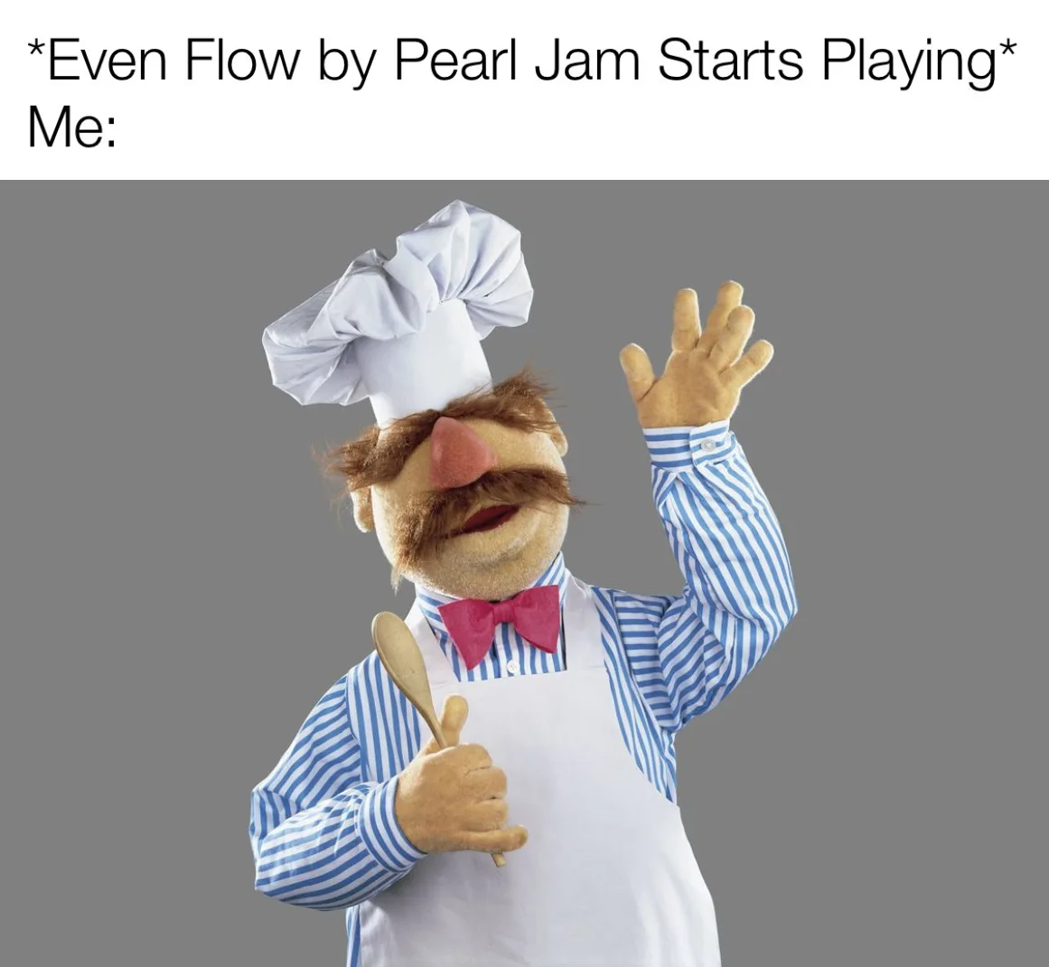 A photo of the Muppet character Miss Piggy dressed as a chef, wearing a white chef's hat, a blue and white striped shirt, a…