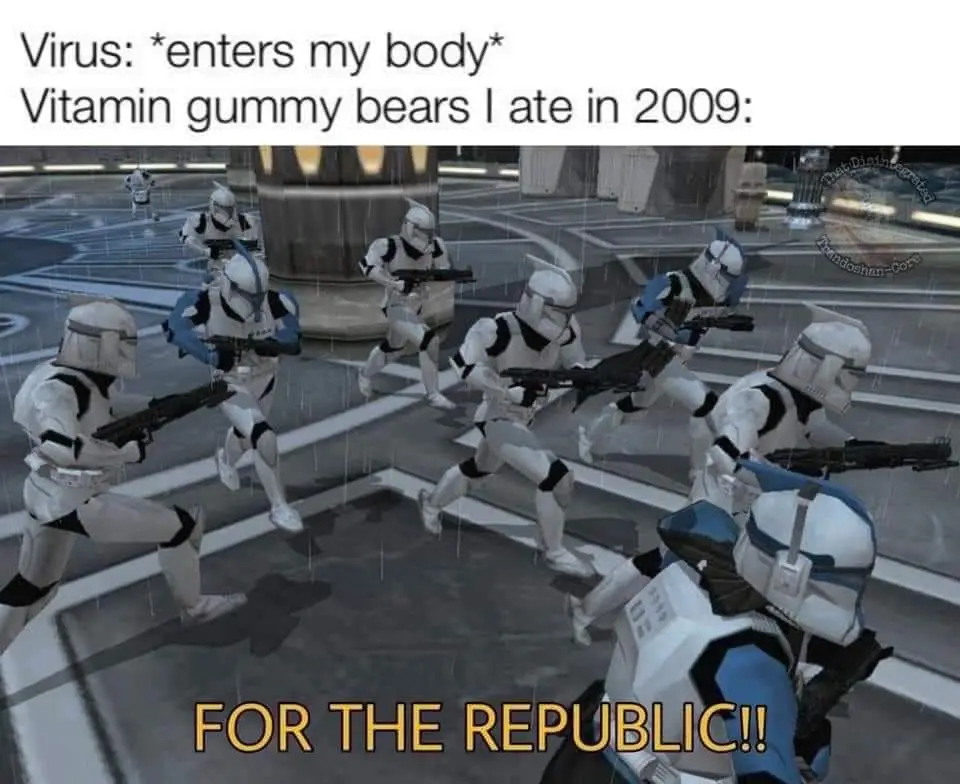 A screenshot from a Star Wars game shows multiple clone troopers running forward in formation through a rainy, futuristic…