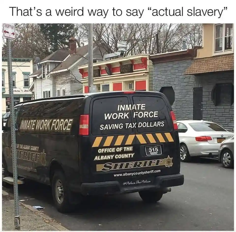 A black van from the Albany County Sheriff's Office is parked on a street, with "INMATE WORK FORCE" and "SAVING TAX DOLLARS"…