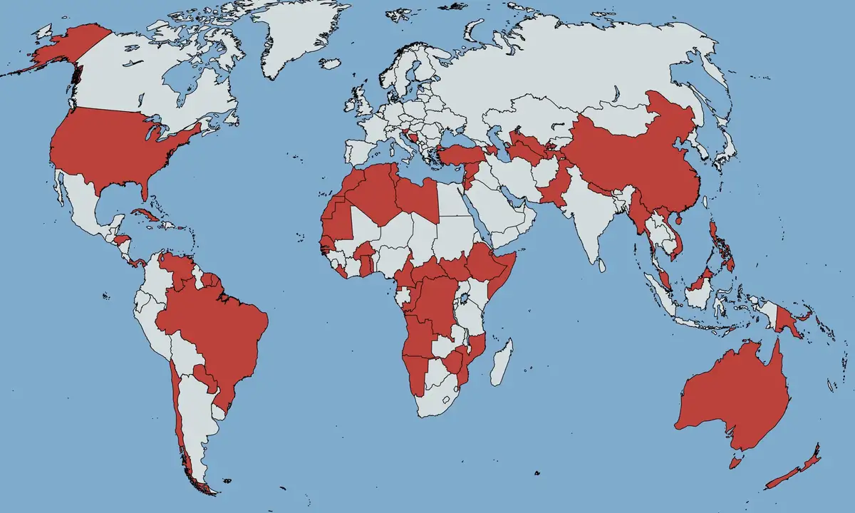 A world map shows most countries colored red, with a few exceptions like Japan, South Korea, and some European nations left…