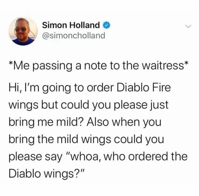 A screenshot of a tweet by Simon Holland showing a humorous note he imagines passing to a waitress. The note requests mild…
