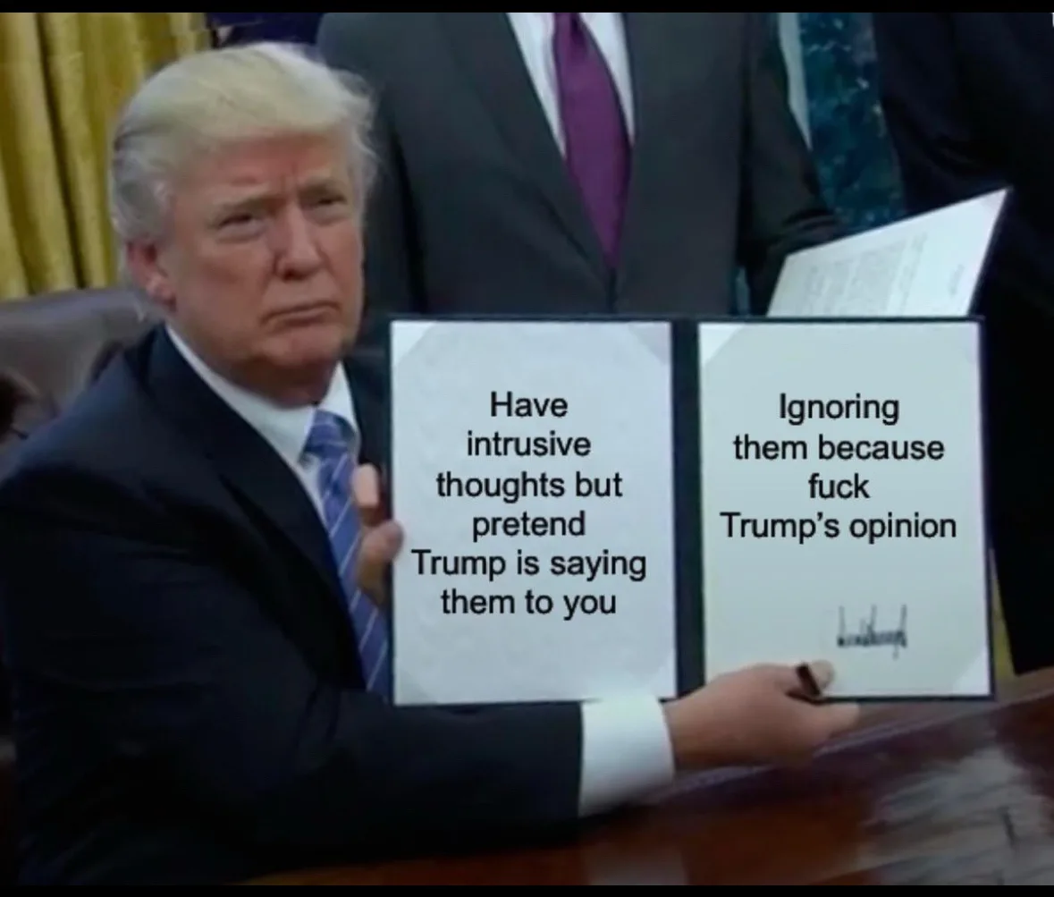A man in a suit sits at a desk holding a binder open to two pages. The left page reads 'Have intrusive thoughts but pretend…