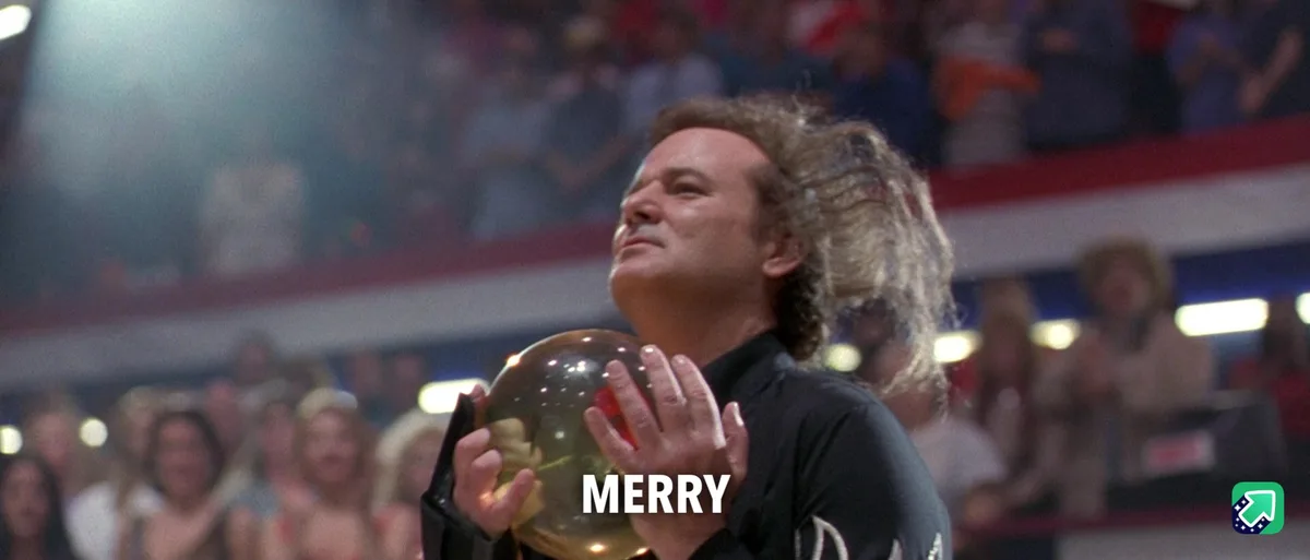 A man with long curly hair, wearing a black shirt, holds a large golden bowling ball while looking upward with a serene…