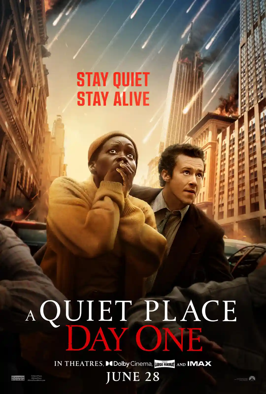 The image is a movie poster for 'A Quiet Place: Day One' showing two terrified people in a city street as meteors rain down…