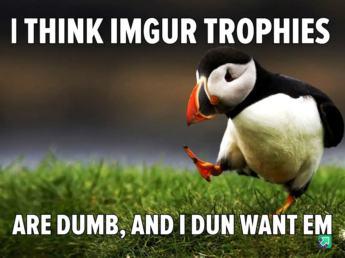 A puffin stands on green grass with a blurred background, looking down with one foot lifted, as if in thought or…