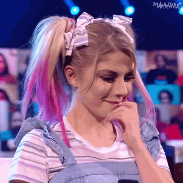 A six-panel grid shows a woman with blonde hair streaked with pink, styled in two high pigtails with white bows, wearing a…