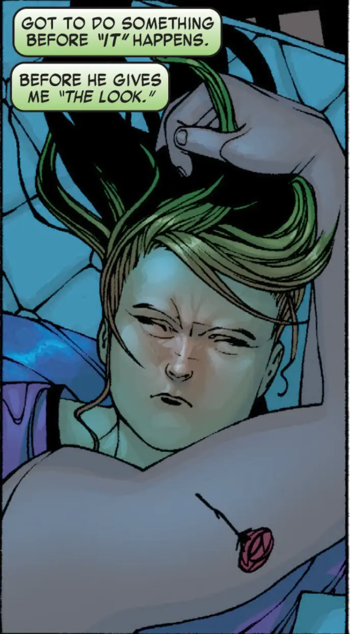 A comic panel shows a person with greenish hair and a rose tattoo on their chest, looking distressed as they hold their…