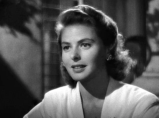 A black-and-white image shows six sequential frames of actress Ingrid Bergman, her expression gradually shifting from a…