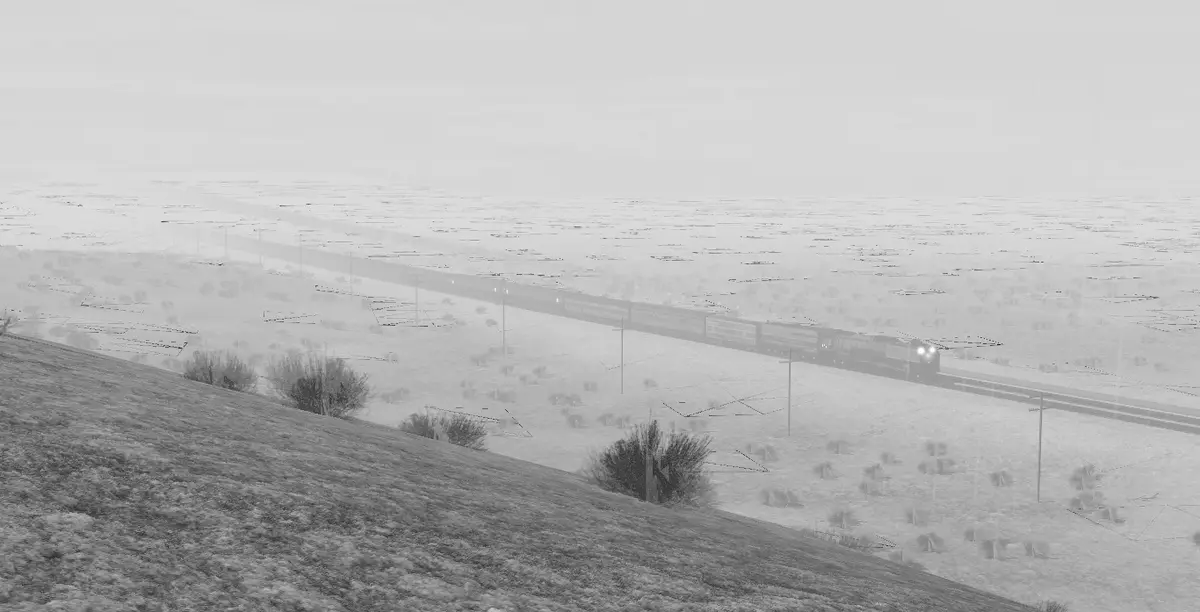 A grayscale image shows a long freight train traveling through a vast, snowy, and desolate landscape under an overcast sky…