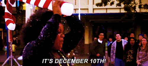 A three-panel meme shows a woman in a festive setting, initially holding a giant candy cane and shouting 'IT'S DECEMBER…