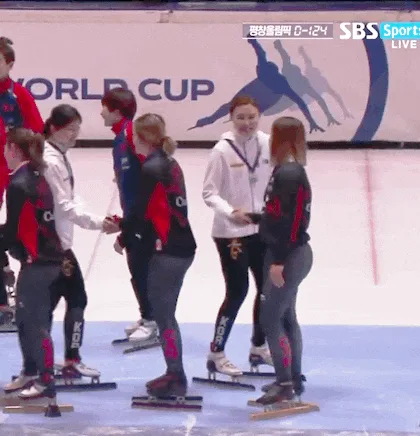 A six-panel sequence from a speed skating event shows a female athlete in a white jacket and black pants, initially shaking…