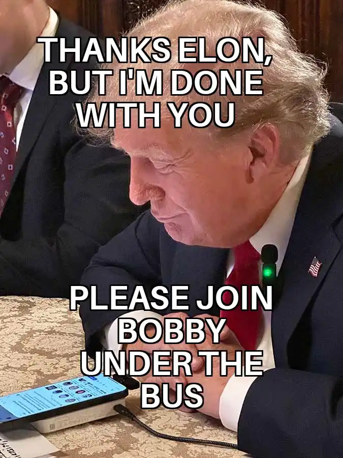 A close-up photo of Donald Trump looking down with a displeased expression, wearing a suit and red tie with an American flag…