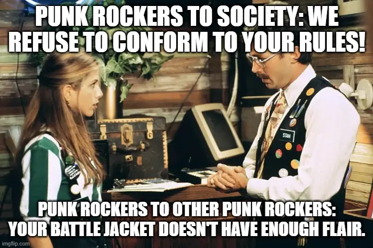 A still from the TV show 'Community' shows a woman in a green and white striped shirt facing a man named Stan in a vest…