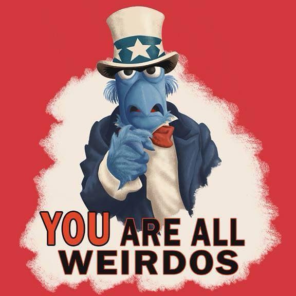 A blue Muppet character wearing a patriotic Uncle Sam top hat and suit points accusingly at the viewer against a red…