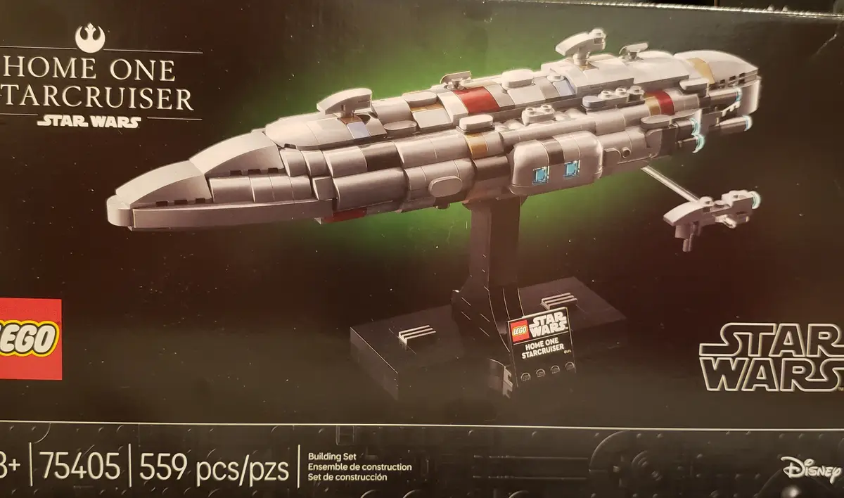 The image shows the front of a LEGO Star Wars product box featuring the 'Home One Starcruiser' model. The box displays a…