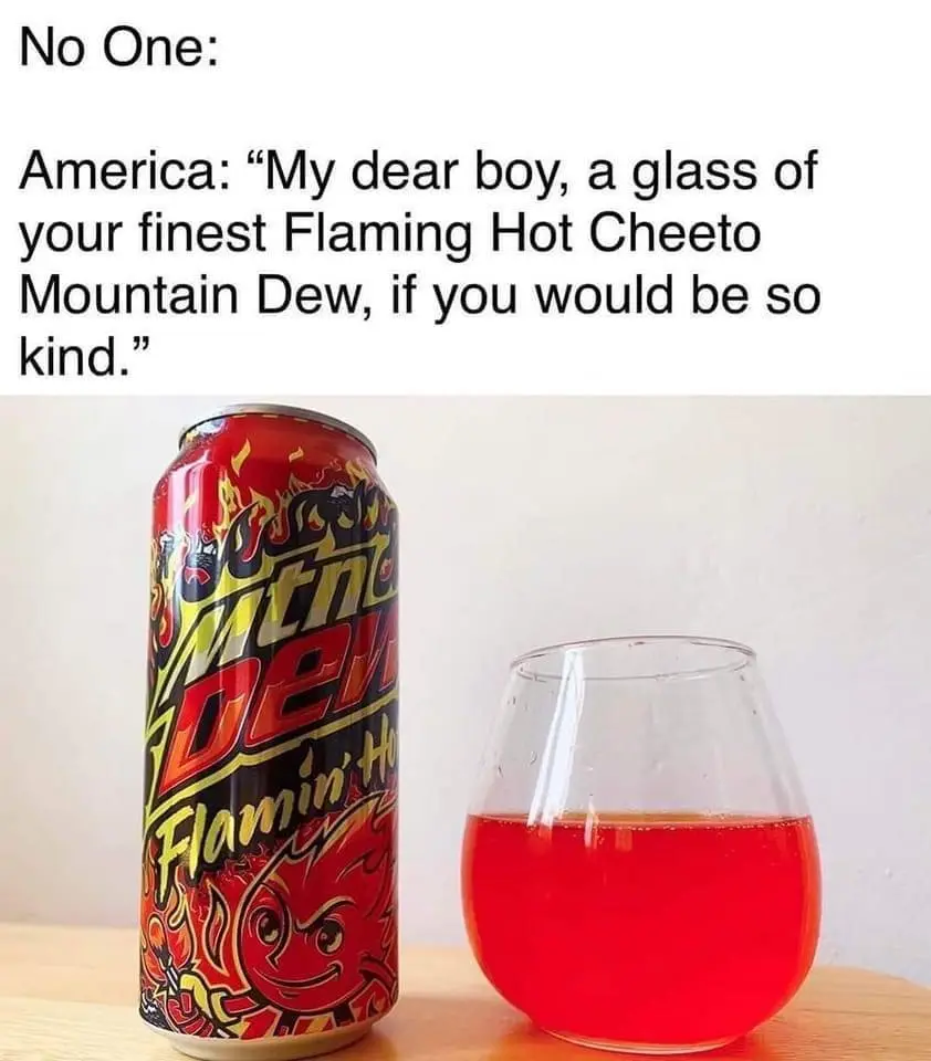 A can of Flamin' Hot Cheeto Mountain Dew sits next to a glass filled with the same red soda. The text above reads 'No One…
