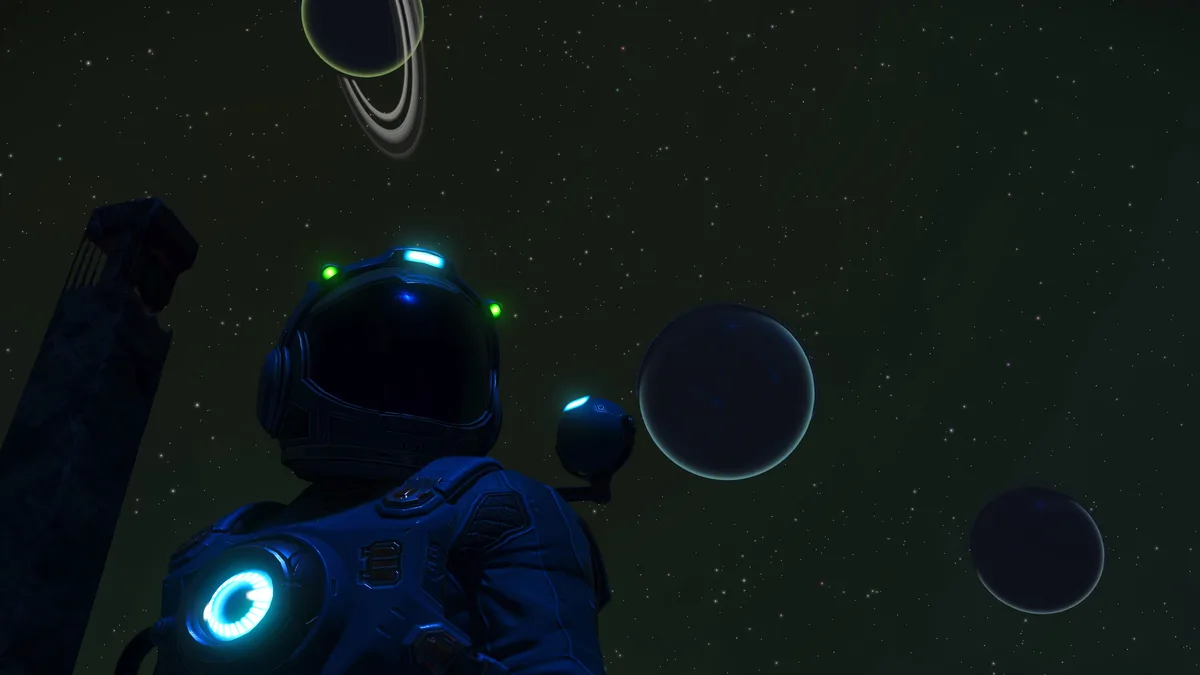 An astronaut in a futuristic blue suit with glowing blue and green lights stands in space, looking up at a starfield with…