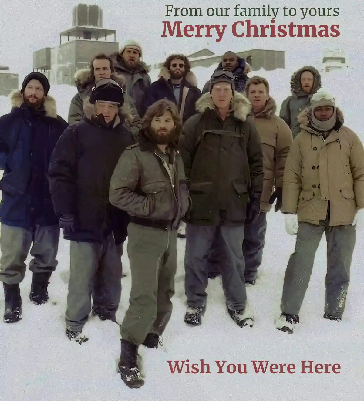 A group of men in heavy winter gear stand in a snowy, barren landscape with industrial buildings in the background. The…