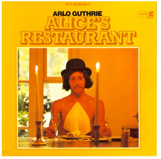 The image is the iconic album cover for 'Alice's Restaurant' by Arlo Guthrie, featuring a man with a wig and bowler hat…