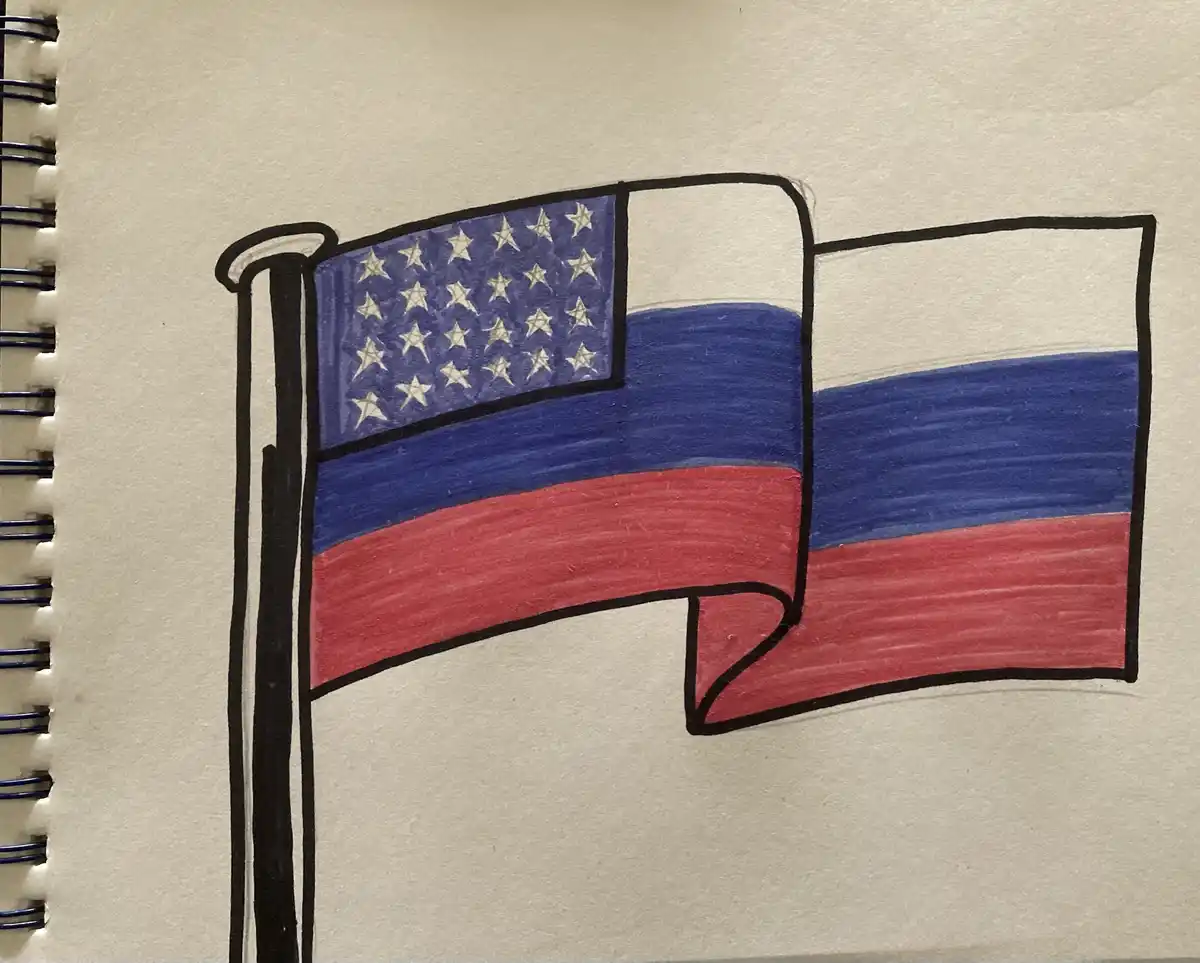 A hand-drawn image in a spiral-bound notebook shows a flagpole with a flag that combines the stars of the American flag with…