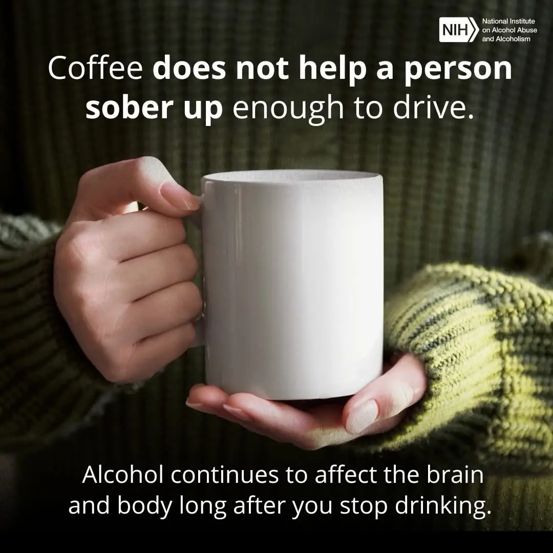 A person wearing a green sweater holds a plain white coffee mug with both hands. Overlaid text states that coffee doesn't…