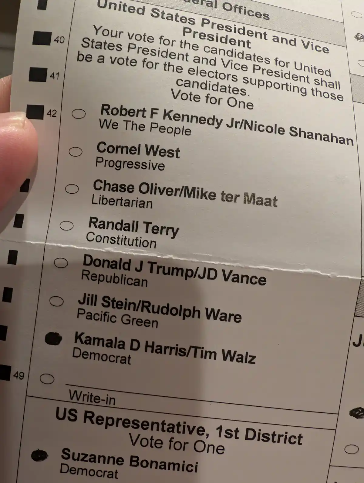 A close-up photo of a US ballot showing the presidential section with multiple candidates listed, including Kamala Harris…