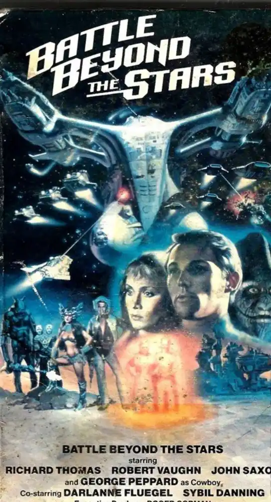A vintage VHS cover for the 1980 sci-fi film 'Battle Beyond the Stars' featuring a large spaceship, smaller fighters, and…
