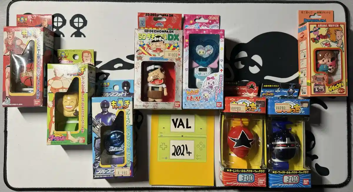 A collection of Japanese Bandai 'Kurutchi' character watches and toys from various anime franchises like Slam Dunk, Dragon…