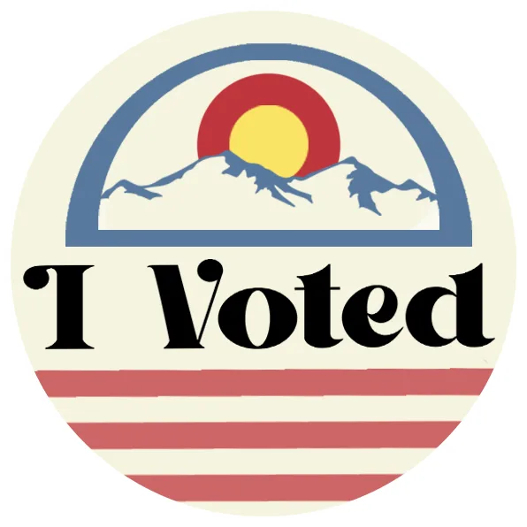 A circular sticker with a stylized mountain range under a red and yellow sun, framed by a blue arch and red stripes, with…