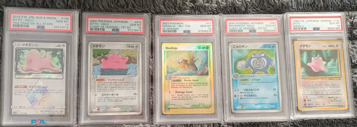Five Pokémon trading cards, including Ditto, Shedinja, and Poliwrath, are displayed in PSA grading slabs. The cards vary in…