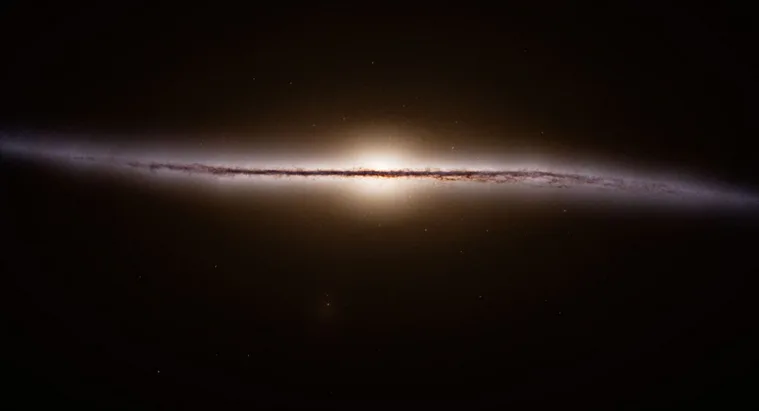 A side-view image of a spiral galaxy, showing its bright central bulge and faint, dusty disk stretching horizontally across…