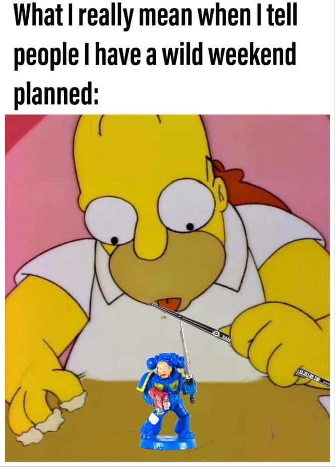 The image shows Homer Simpson from The Simpsons, looking down with a shocked expression at a small blue action figure of a…