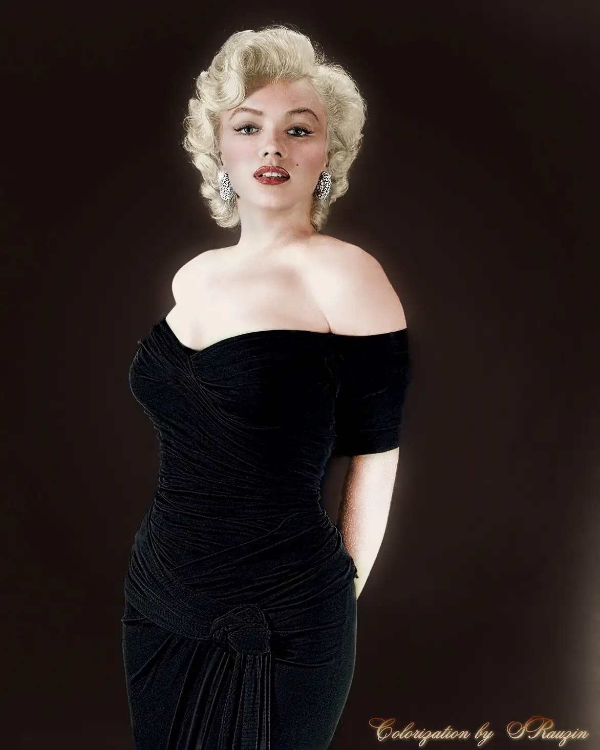 A colorized portrait of Marilyn Monroe wearing a black off-the-shoulder velvet dress with a bow at the waist, posing against…