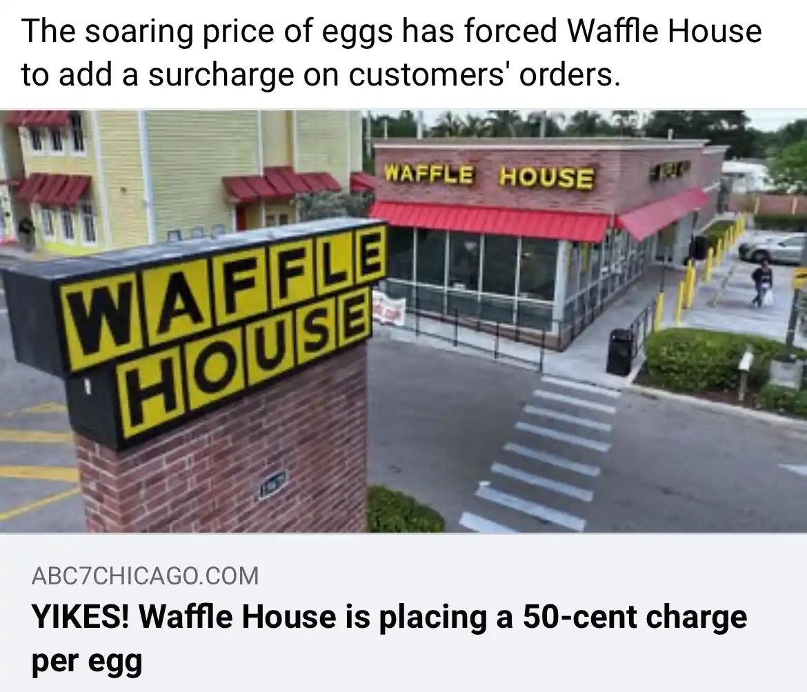 An exterior photo of a Waffle House restaurant with its iconic yellow and black sign visible on a brick pillar and on the…